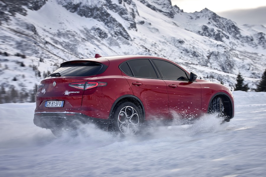 The Alpha Romero Q4 speeding through the snow in the mountains.
